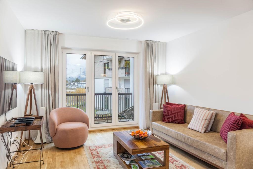 a living room with a couch and a chair at Apartment zum Genießen in Garmisch-Partenkirchen