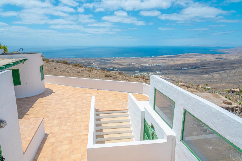 a view of the ocean from a house at Lanzarote Suite Moon in Tías
