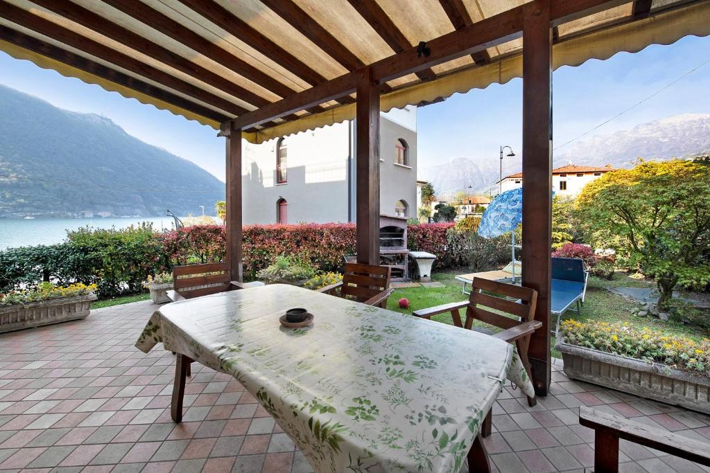 a table on a patio with a view of the water at Wakesurfhouse in Sulzano
