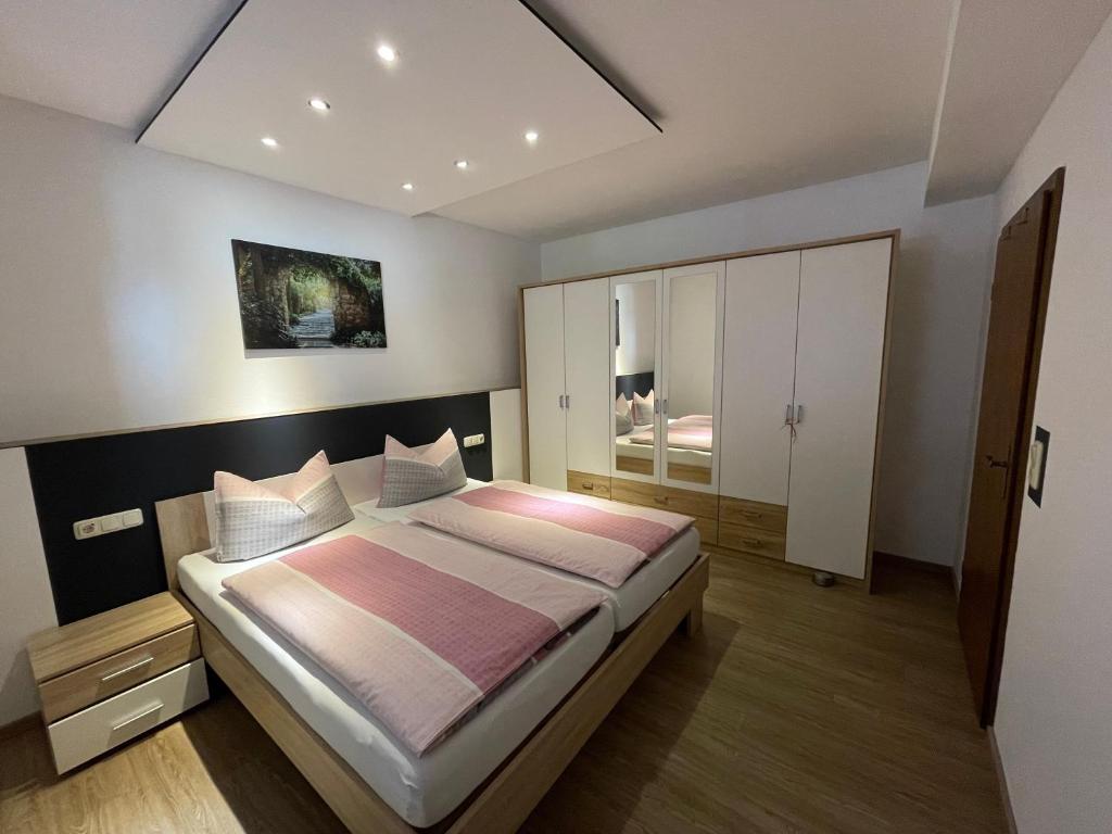 a bedroom with a large bed in a room at Ferienwohnung M Keller in Hollfeld