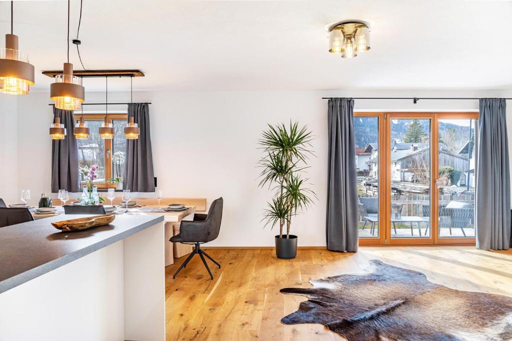 a kitchen and living room with a wolf rug on the floor at Apartment Luisa in Scharnitz