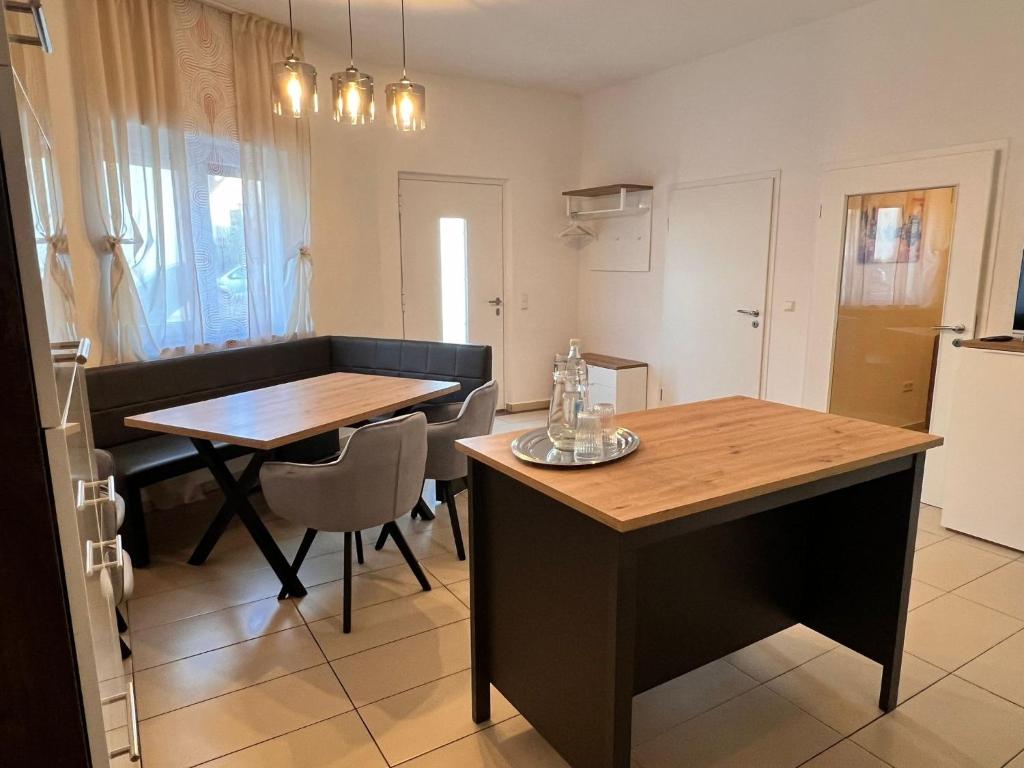 a small kitchen with a table and a dining room at Dreams Lodge in Koetz 