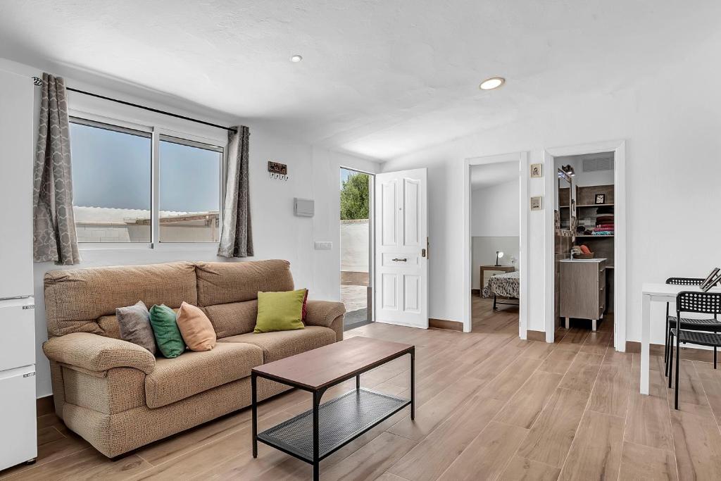 a living room with a couch and a table at Loft Rural in El Soto