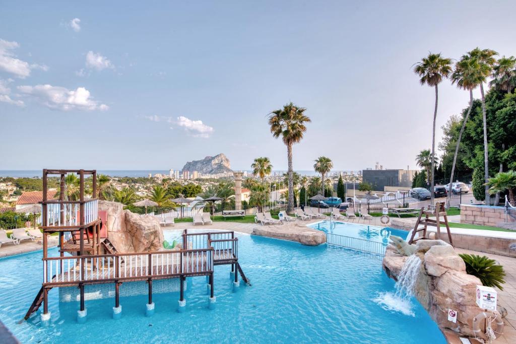 a pool at a resort with a water slide at Clementina Imperial Park in Calpe