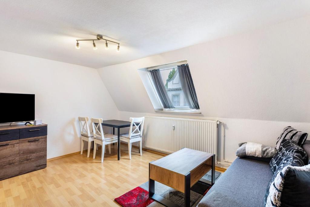 a living room with a couch and a table at Ferienwohnung Am Osttor in Warendorf