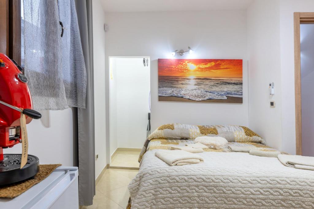 a bedroom with a bed with pillows on it at L'aurora in San Vito dei Normanni