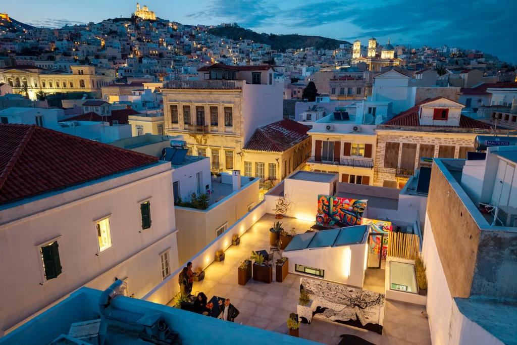 a view of the city at night at Artrock Experience Loft Gallery in Ermoupoli