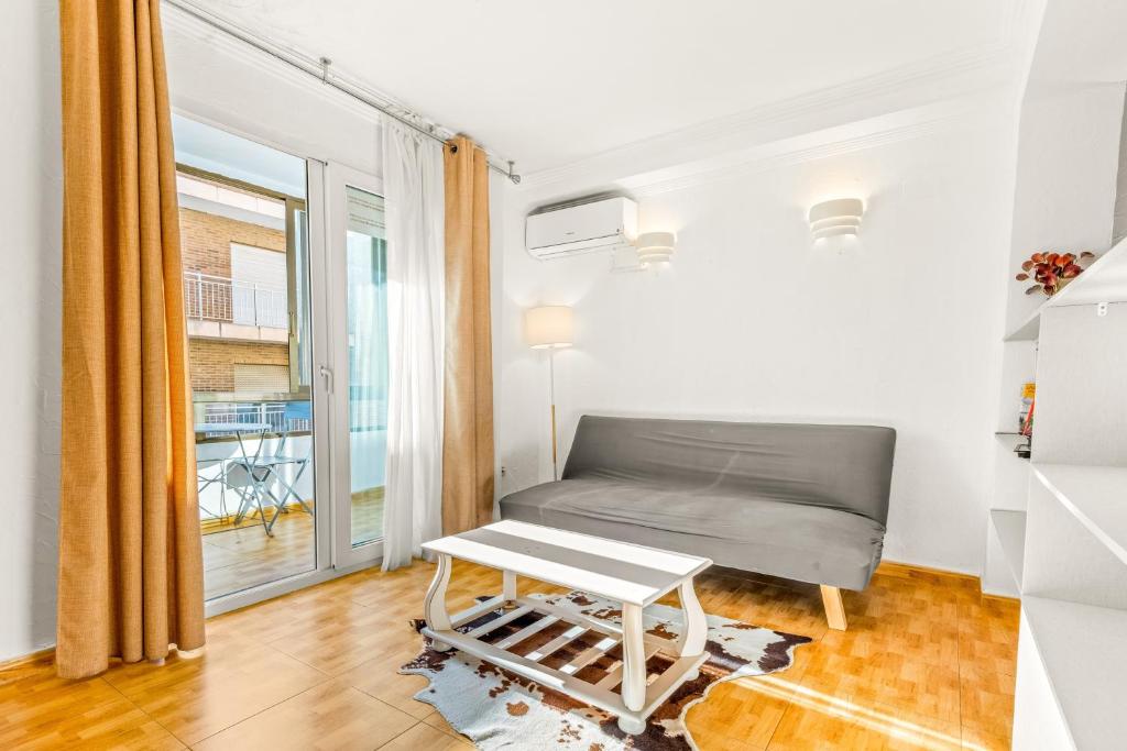 a room with a bed and a table at Unique Apartahotel 4-2 in Torrevieja