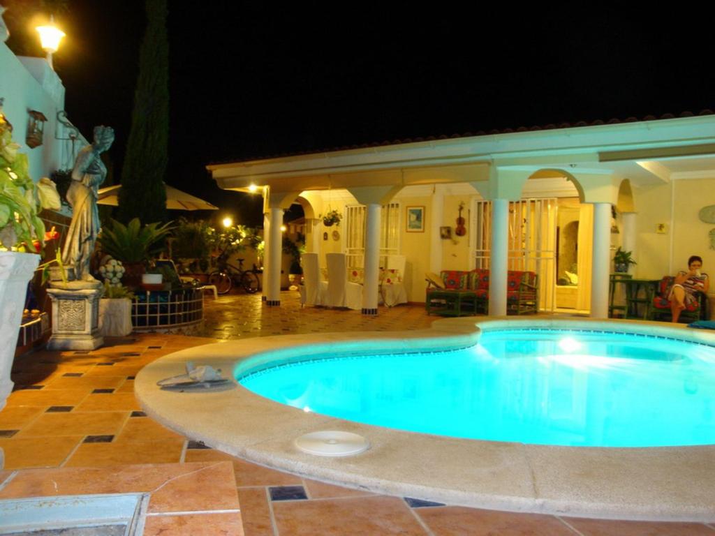 a swimming pool in a yard at night at Romantic Villa with private Pool in Adeje