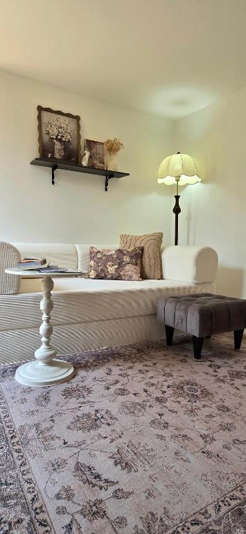 a living room with a couch and a table at Ari & Alki Garden in Ban Nong Nam Khan