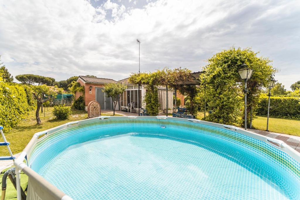a swimming pool in the yard of a house at Maitemare in Traspinedo