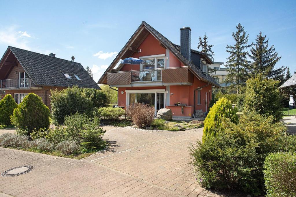 a house with a brick driveway in front of it at Fewo 20 Röbel Müritzblickhaus in Röbel
