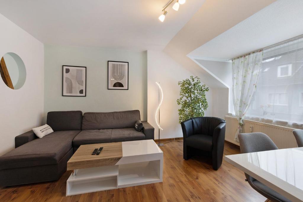 a living room with a couch and a table at Tifra-living in Hardenberg