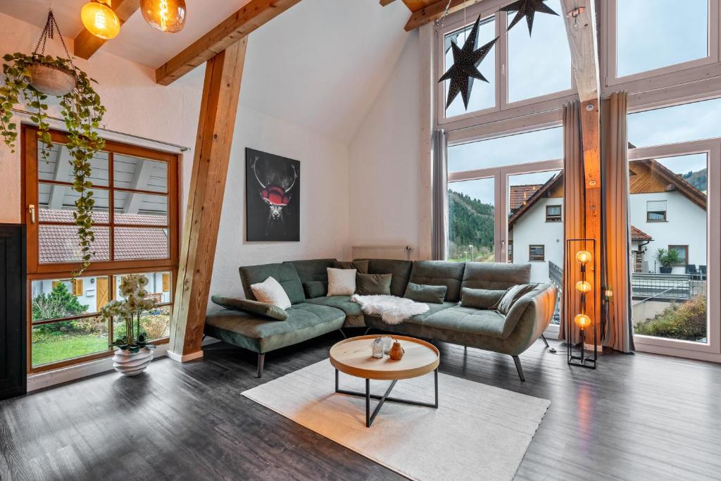 a living room with a couch and a table at Schwarzwaldmomente in Hornberg