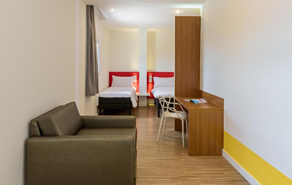 Postel nebo postele na pokoji v ubytování ibis Styles Birigui