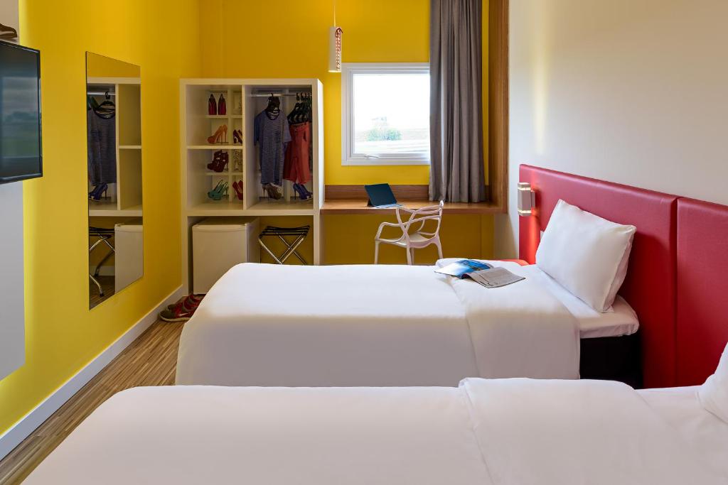Postel nebo postele na pokoji v ubytování ibis Styles Birigui