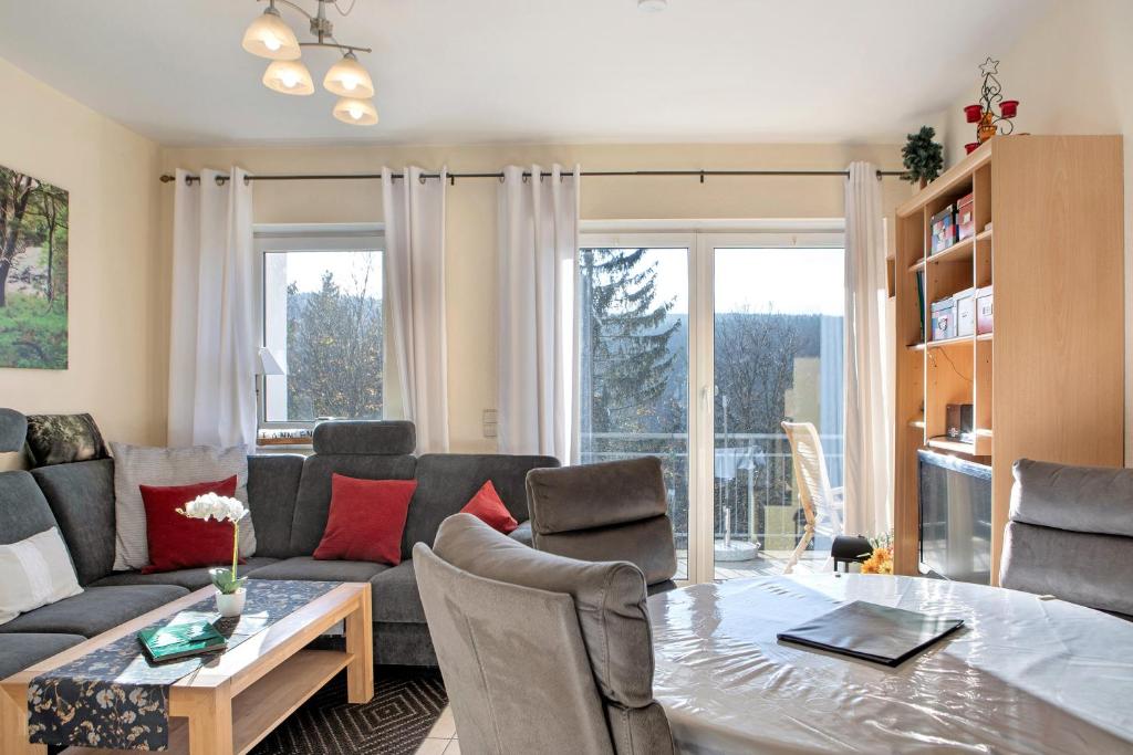 a living room with a couch and a table at Ferienwohnung Tannenblick 8-1 in Oberhof