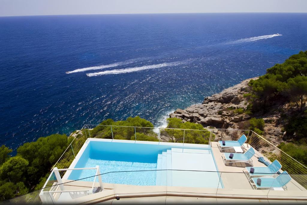 a house with a view of the ocean at Villa Blanca in Capdepera
