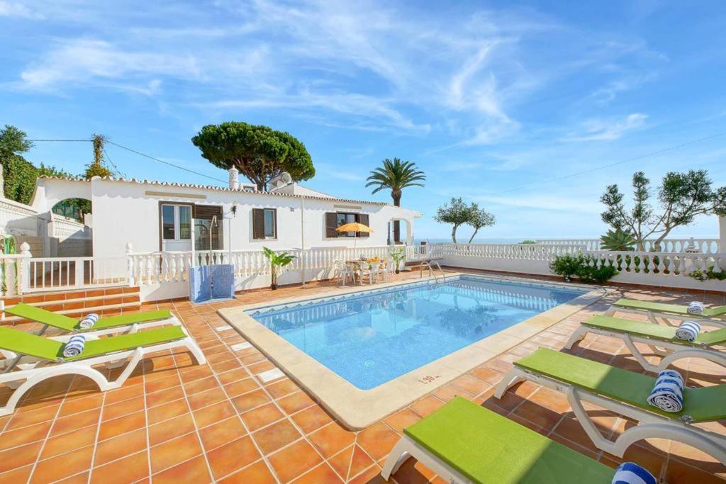 a villa with a swimming pool and a house at Villa Brigida in Patroves