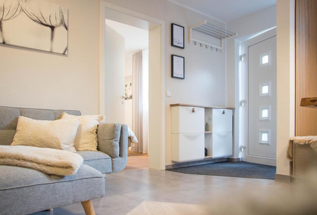 a living room with a couch and a chair at Ferienwohnung Auszeit in Salem