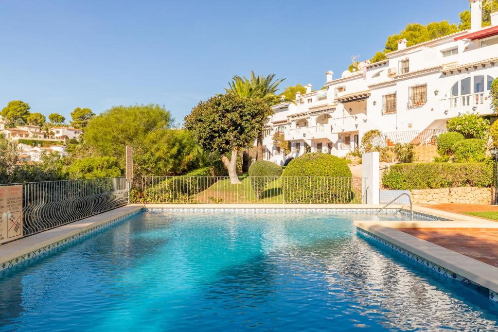 a swimming pool in front of a house at Casa Sillero Dos in Moraira