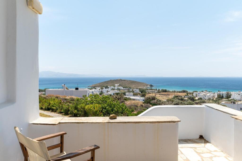 a balcony with a view of the ocean at Anemologio 303 Tinos in Agios Ioannis