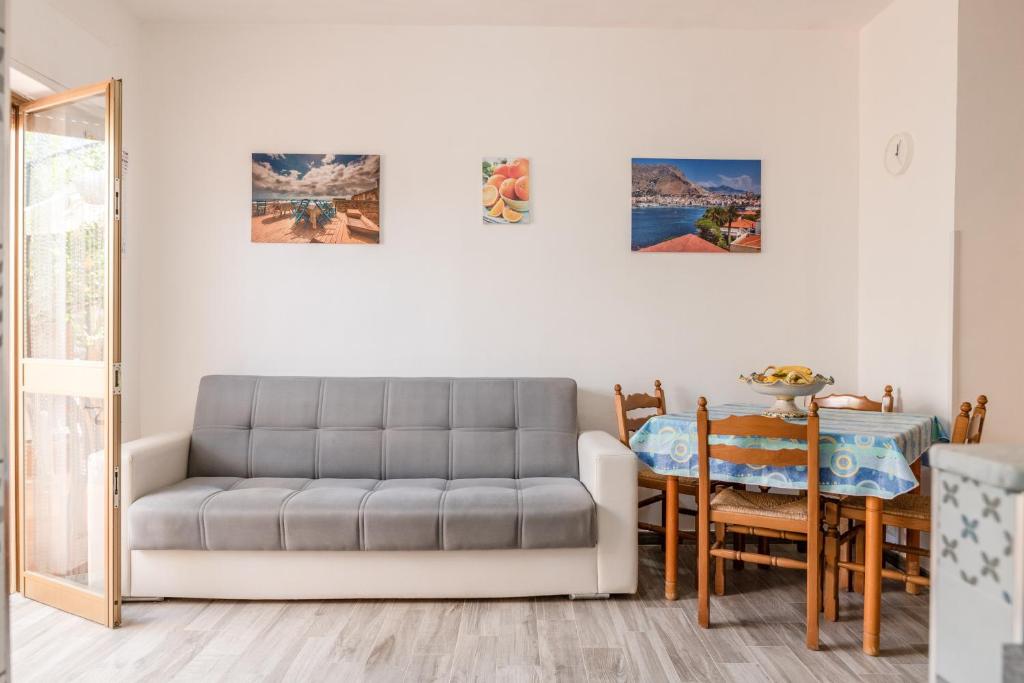 a living room with a couch and a table at Monolocale Arredato - Le Terrazze in Ribera