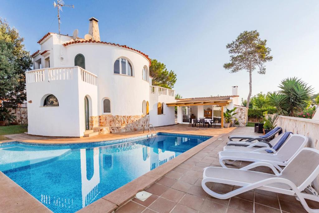 an image of a villa with a swimming pool at Chalet Es Llossar in Cala en Blanes