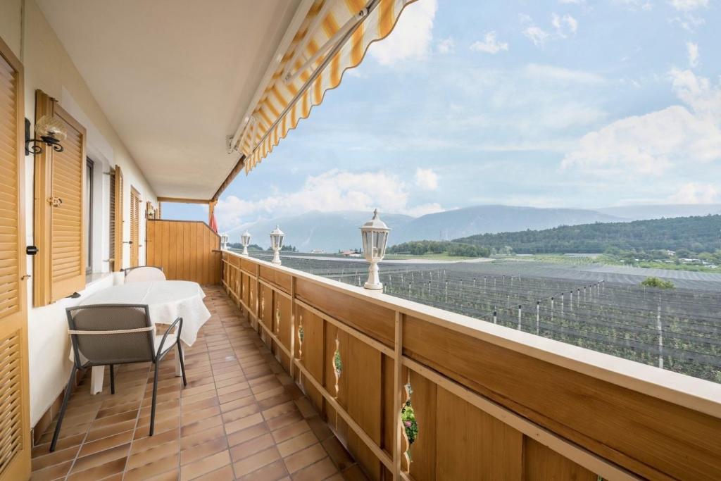 a balcony with a view of the water at Residence Kronstein - Fewo 6 in Tesimo