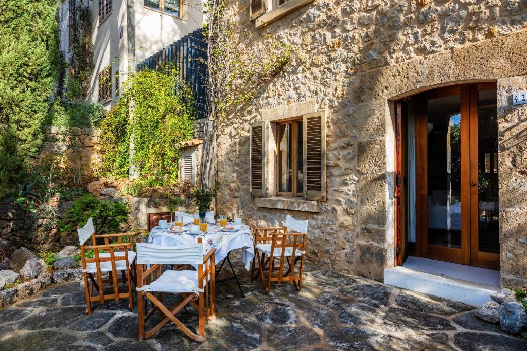 a table set up outside of a building at Casa en Centro Histórico Pollença in Pollença
