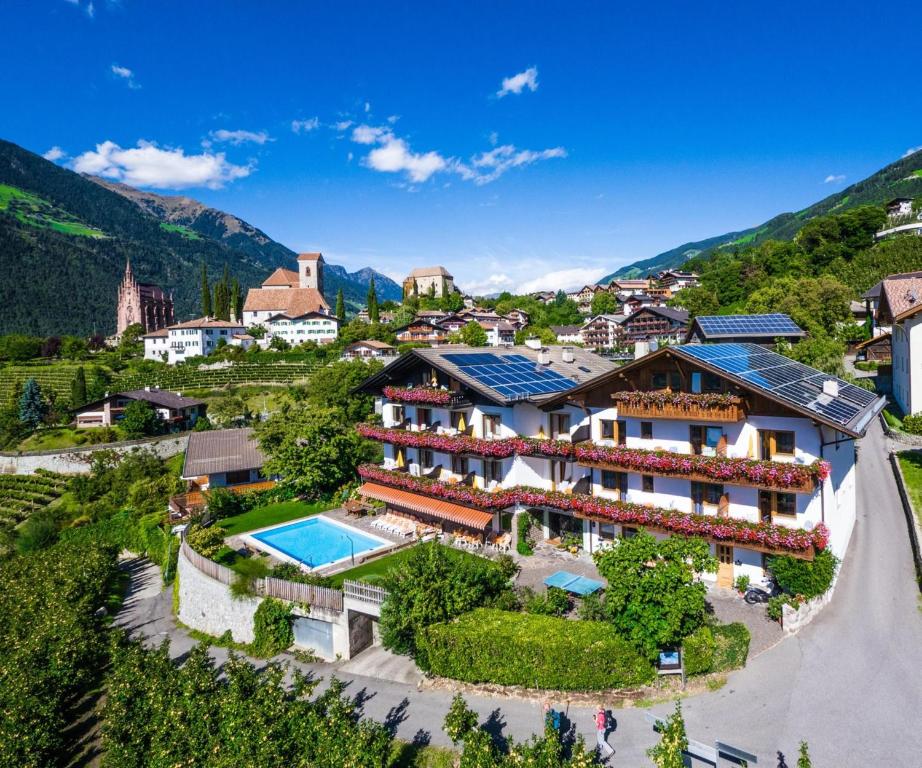 an aerial view of a resort in the mountains at Gartenheim App Franz in Schenna