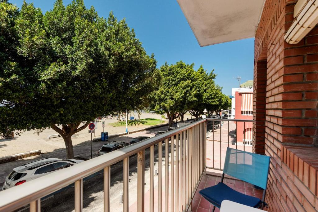 a balcony with a view of a parking lot at Casa Coral Beach in Málaga