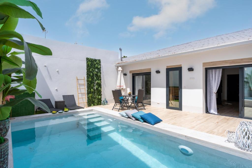 a villa with a swimming pool and a house at Casa Catral Alfalfar 12 in Catral