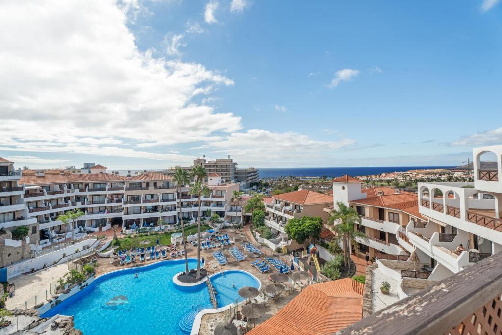 an aerial view of a resort with a swimming pool at Oasis del Sur in San Miguel de Abona