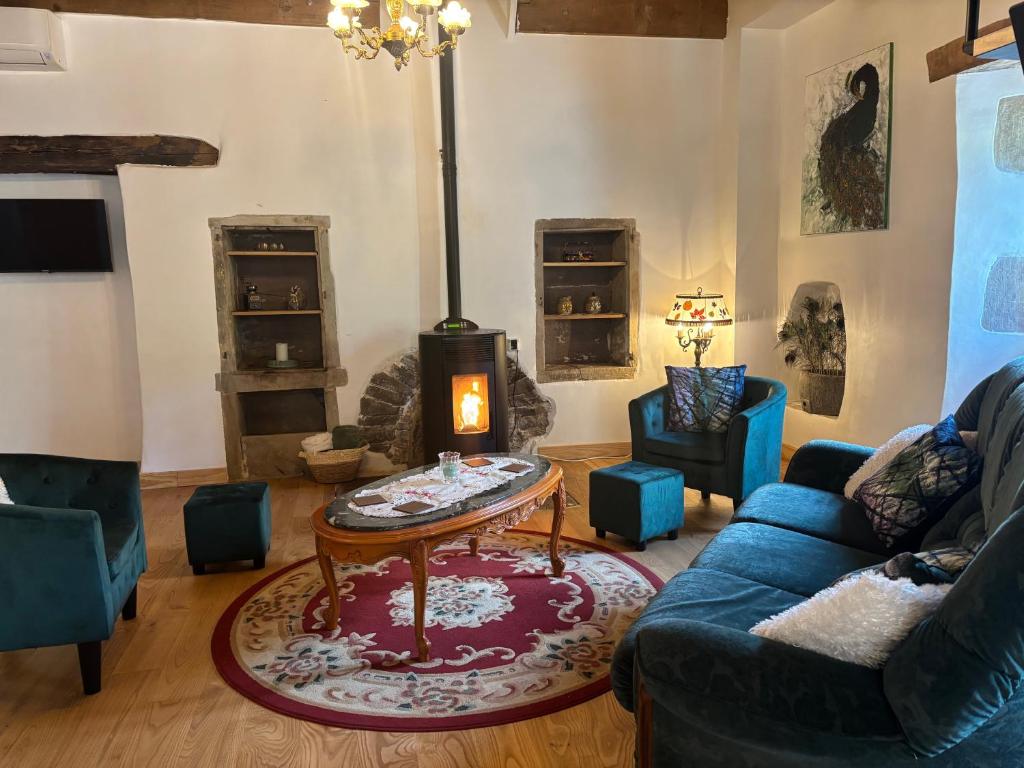 a living room with a couch and a coffee table at L’Angelina in Martrin