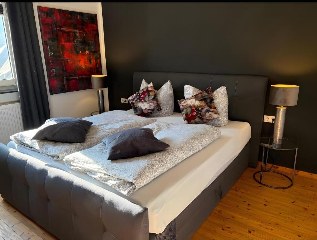 two beds with pillows on them in a bedroom at Ferienwohnung Auszeit in Bad Bertrich