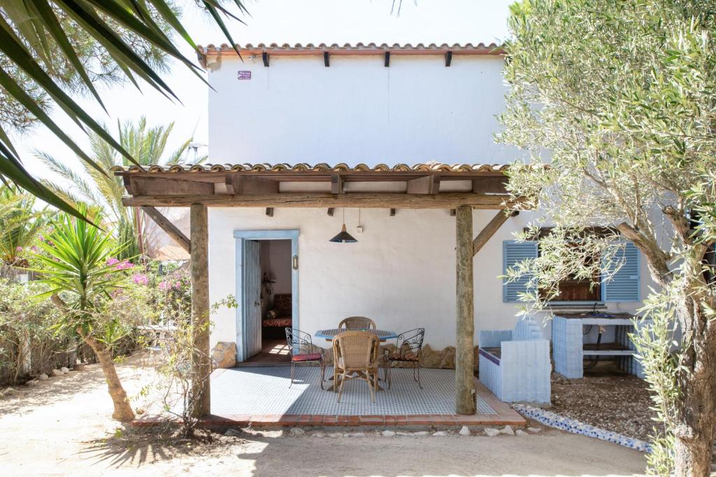 a patio in front of a white house at Casa Azul - Vejer, El Palmar in Vejer de la Frontera