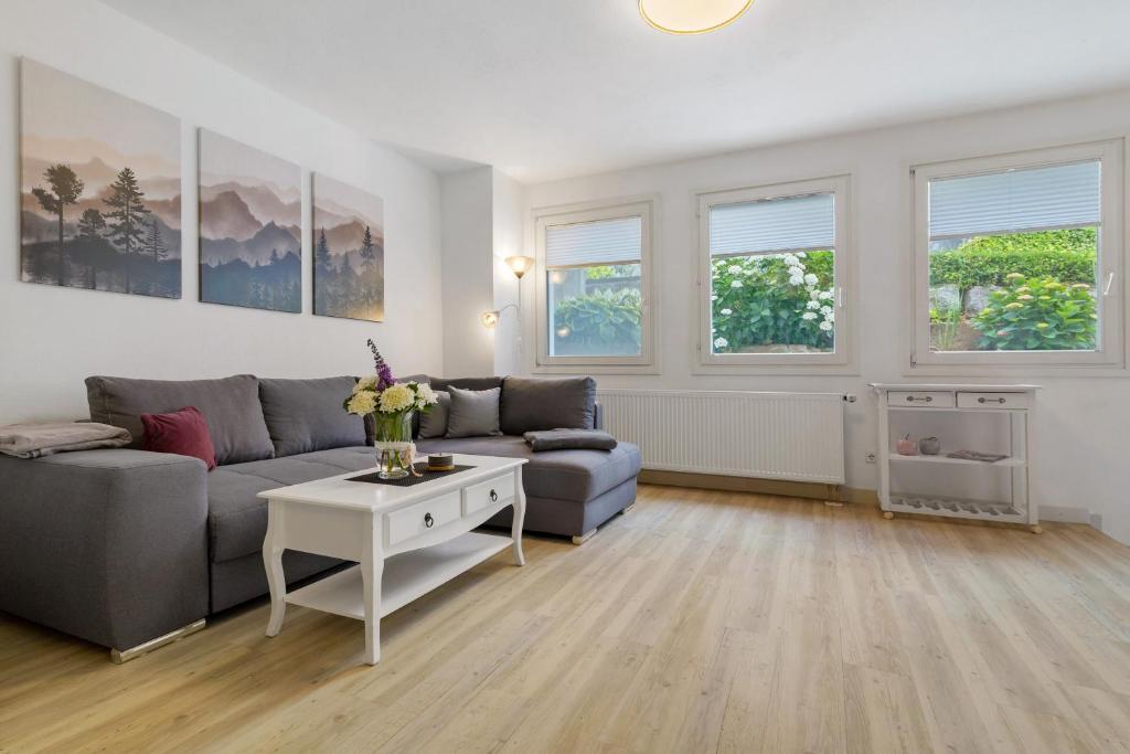 a living room with a couch and a table at Casa Bianca in Offenburg