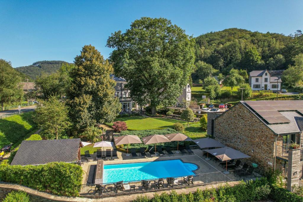an aerial view of a resort with a swimming pool at Hotel Le Charme de la Semois in Alle
