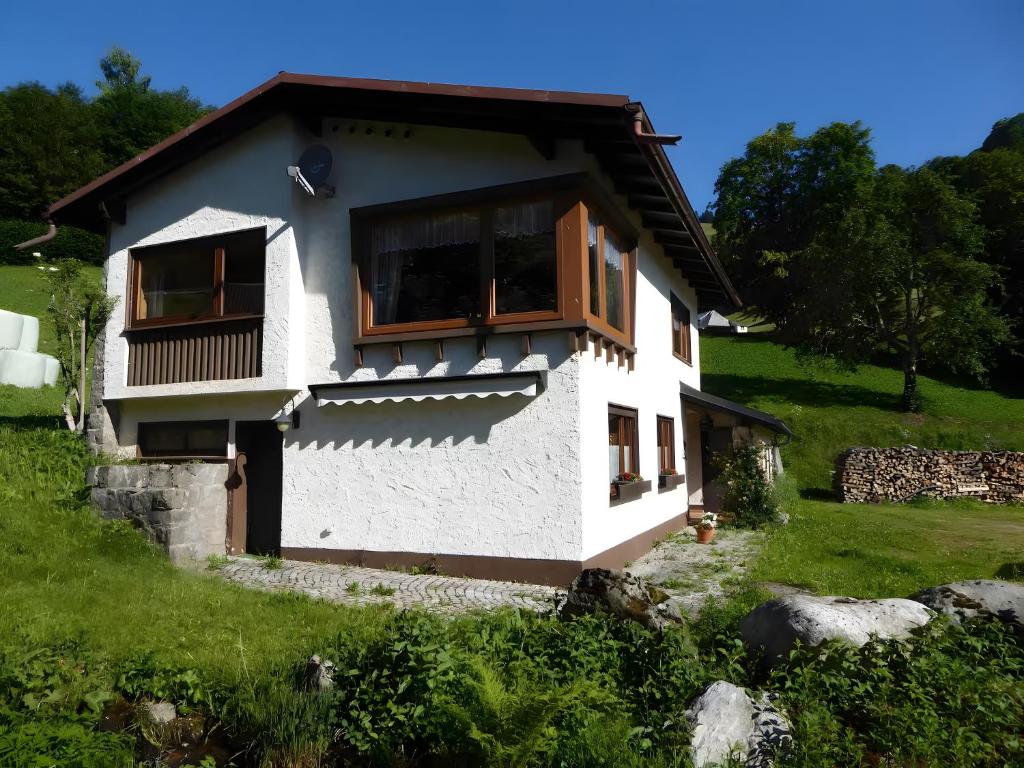 a house in the middle of a field at Ferienhaus am Bach in Wieden