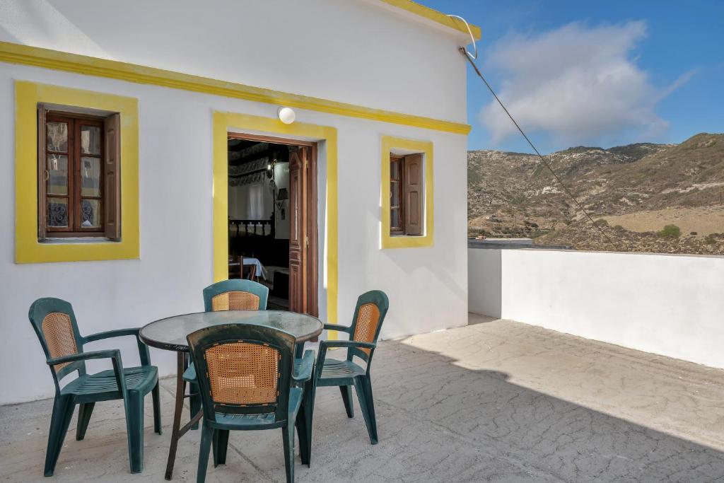 a table and chairs sitting on a patio at Villa Houvarda in Karpathos