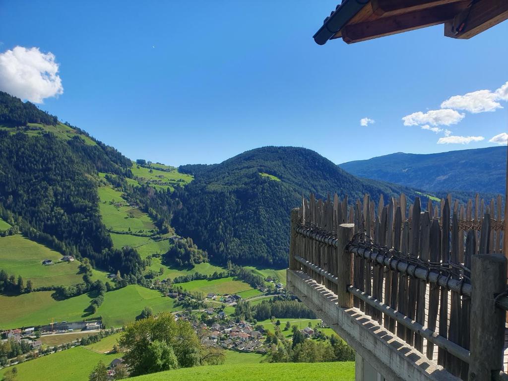 a view from a balcony of a valley with mountains at Tratterhof Apt Eidechsspitze in Vandoies