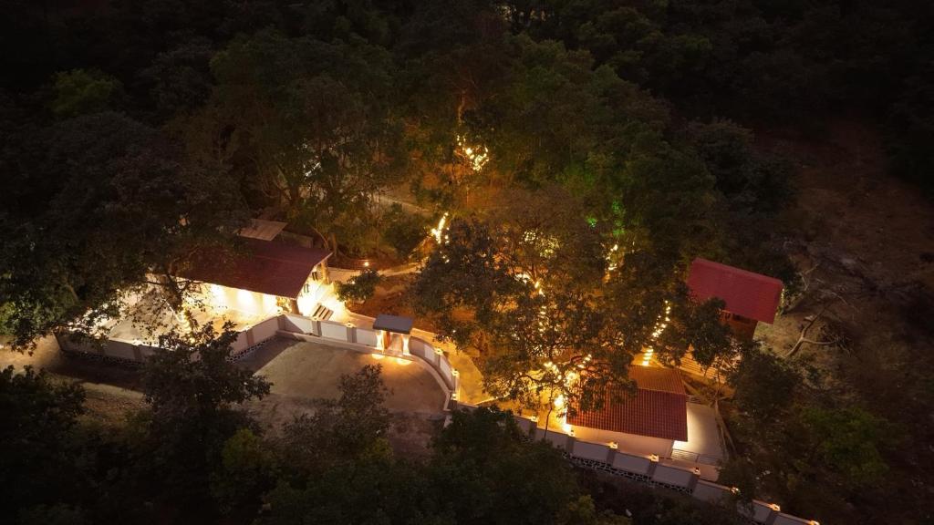 an overhead view of a house at night with lights at Crystal Water in Mulshi