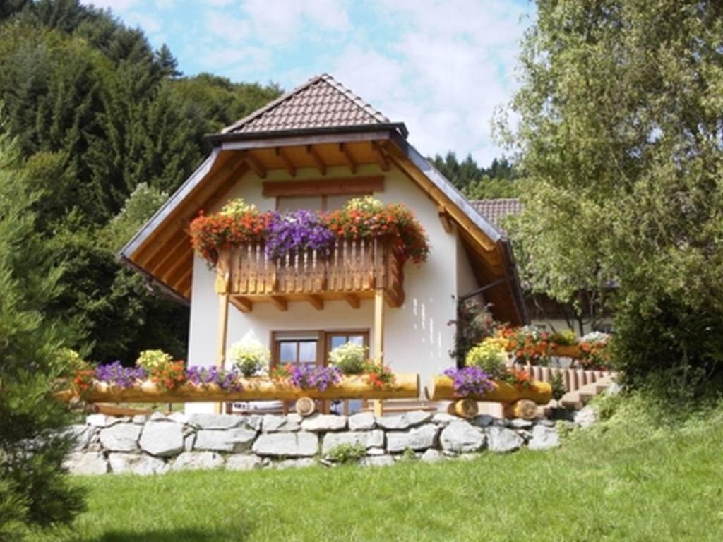 a small house with flowers in front of it at Kempfenhof in Seelbach