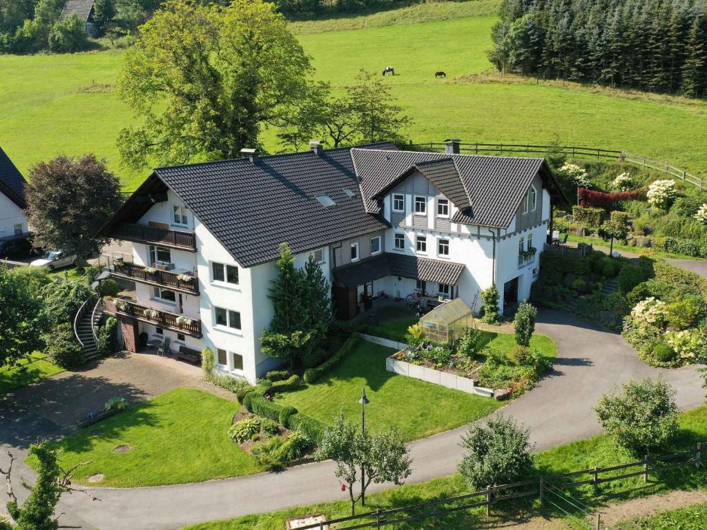 an aerial view of a large house at Ferienwohnungen Familie Schauerte in Schmallenberg