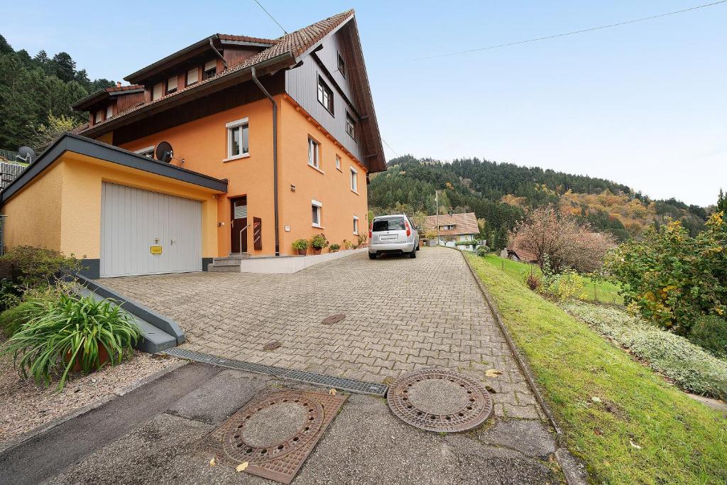 a car is parked in front of a house at Ferienwohnung Morgensonne in Wolfach