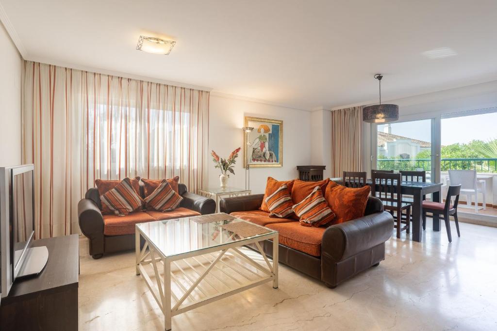 a living room with a couch and a table at Guadalmina Baja in Marbella