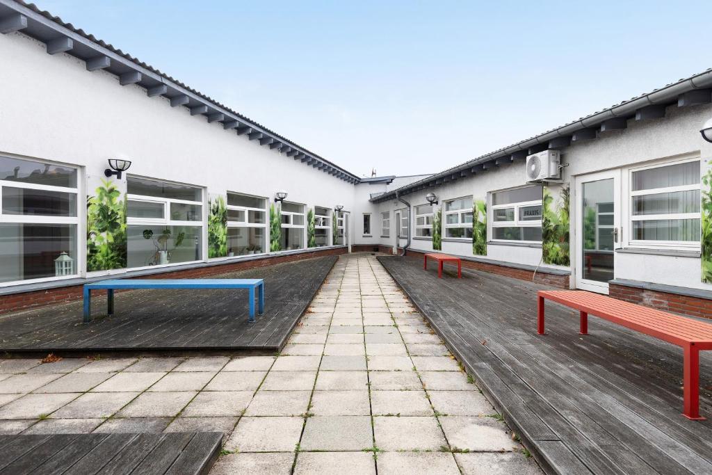 an empty courtyard of a building with benches at Albrechtshof in Potsdam