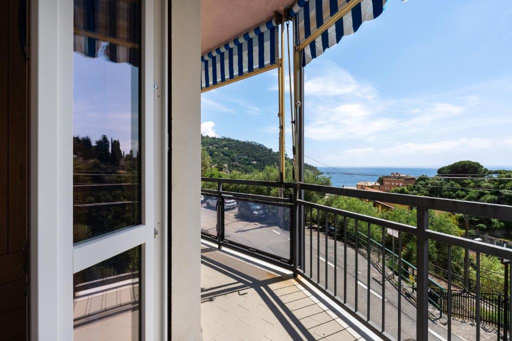 a room with a view of the ocean from a balcony at Ca Giannina in Bonassola