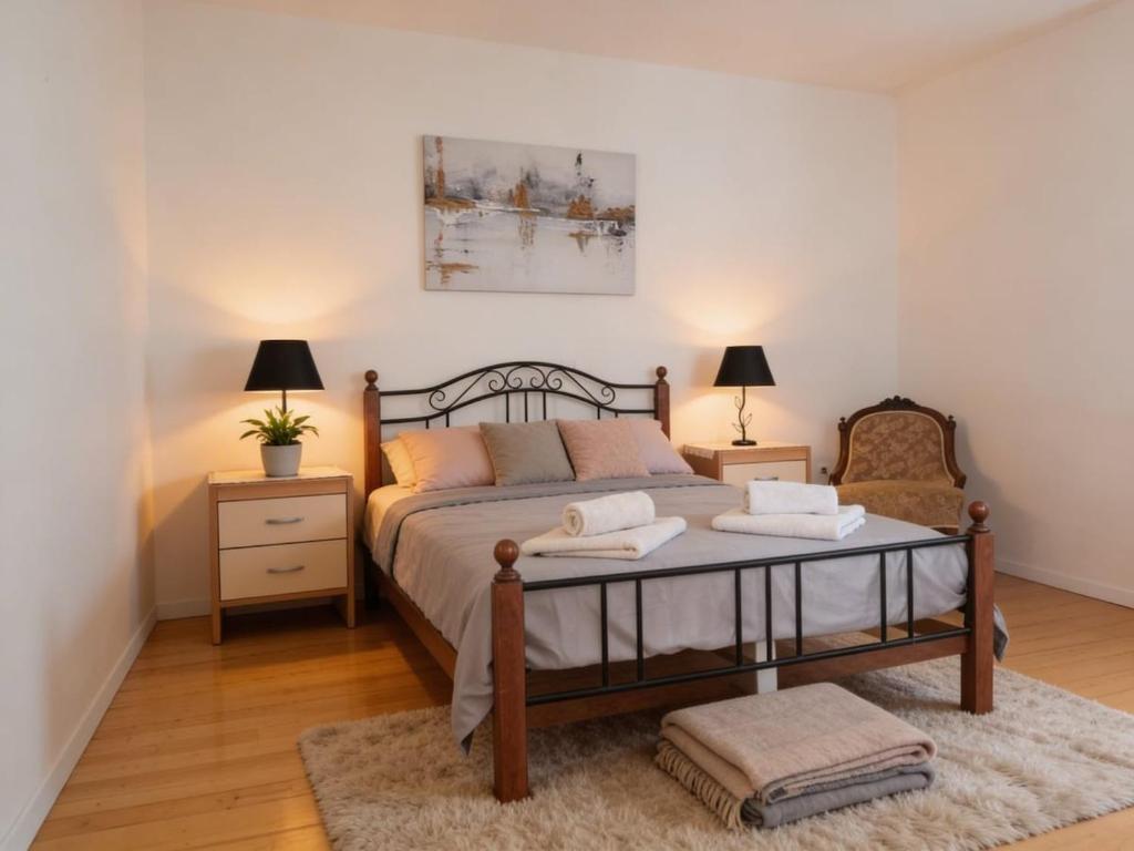 a bedroom with a large bed with two night stands at Dream Home in Lopud